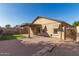 Private backyard with covered patio, gravel landscaping, and manicured lawn offers relaxing outdoor enjoyment at 8566 N 110Th Ave, Peoria, AZ 85345