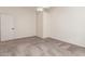 Neutral bedroom includes plush carpet, a ceiling fan, and access to ensuite bathroom at 8566 N 110Th Ave, Peoria, AZ 85345
