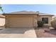 Charming single story home showcasing a two-car garage and low maintenance desert landscaping at 8566 N 110Th Ave, Peoria, AZ 85345