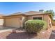 Charming single story home showcasing a two-car garage and low maintenance desert landscaping at 8566 N 110Th Ave, Peoria, AZ 85345