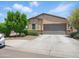 Charming single-story home with a well-manicured lawn, two-car garage, and inviting curb appeal at 10236 W Wood St, Tolleson, AZ 85353