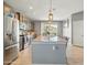 Spacious kitchen featuring stainless steel appliances, a large center island, and recessed lighting at 10236 W Wood St, Tolleson, AZ 85353