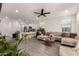 Inviting living room with an open-concept design, neutral colors, and tile floors, perfect for entertaining at 12505 W Kaler Dr, Glendale, AZ 85307