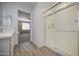 Bathroom with walk-in glass shower, tile floor, and view to bedroom at 12515 W Marguerite Ave, Avondale, AZ 85323