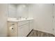 Bright bathroom featuring a dual sink vanity with white cabinets and modern fixtures, offering ample counter space at 12515 W Marguerite Ave, Avondale, AZ 85323
