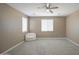 Bright bedroom featuring neutral paint, ceiling fan and carpeted floors at 12515 W Marguerite Ave, Avondale, AZ 85323