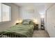 Cozy bedroom featuring a bed, nightstands, a window with blinds, and a carpeted floor at 12515 W Marguerite Ave, Avondale, AZ 85323