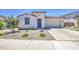 Charming single-story home with desert landscaping and a spacious two-car garage at 12515 W Marguerite Ave, Avondale, AZ 85323