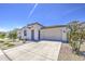 Well-maintained one-story home with drought-tolerant landscaping and a clean concrete driveway at 12515 W Marguerite Ave, Avondale, AZ 85323