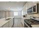 Kitchen features stainless steel appliances and an island at 12515 W Marguerite Ave, Avondale, AZ 85323