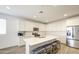 Modern kitchen with island, stainless steel appliances and ample cabinet space at 12515 W Marguerite Ave, Avondale, AZ 85323