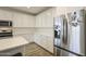 Spacious kitchen with stainless steel appliances and white cabinetry at 12515 W Marguerite Ave, Avondale, AZ 85323