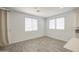 Bright, open living room with lots of natural light and gray wood-style flooring at 12515 W Marguerite Ave, Avondale, AZ 85323