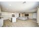 Large living space featuring an open kitchen that transitions into a comfortable living room area at 12515 W Marguerite Ave, Avondale, AZ 85323