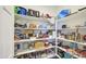 Organized walk-in pantry with shelving providing ample storage space for groceries at 12515 W Marguerite Ave, Avondale, AZ 85323