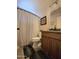 Cozy bathroom featuring a patterned shower curtain and wood vanity at 13037 W Laurel Ln, El Mirage, AZ 85335