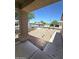 Inviting covered porch with a view of the low maintenance desert landscaping at 13037 W Laurel Ln, El Mirage, AZ 85335