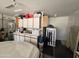 Interior view of a well-organized garage with storage cabinets and ample space for parking at 13037 W Laurel Ln, El Mirage, AZ 85335