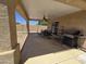Covered patio with ceiling fan, seating and BBQ area, great for entertaining at 13037 W Laurel Ln, El Mirage, AZ 85335