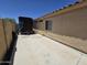 Spacious side yard with concrete slab, offering potential for storage or recreational use at 13037 W Laurel Ln, El Mirage, AZ 85335
