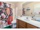 Bathroom featuring a vanity, toilet, shower, and floral patterned shower curtain at 1376 E Rosemary Trl, Casa Grande, AZ 85122