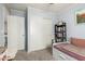 Bedroom with bed, bookcase, and a large closet with sliding doors at 1376 E Rosemary Trl, Casa Grande, AZ 85122