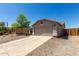 Charming single-story home features low-maintenance landscaping and attached two car garage at 1376 E Rosemary Trl, Casa Grande, AZ 85122