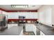 Functional kitchen featuring stainless steel appliances, white cabinetry, and ample counter space at 1376 E Rosemary Trl, Casa Grande, AZ 85122
