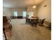 Spacious living room with ample seating, large windows, and neutral carpet at 13857 N 108Th Dr, Sun City, AZ 85351
