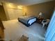 Large bedroom with built in storage cabinets, neutral carpet and plenty of light at 13857 N 108Th Dr, Sun City, AZ 85351