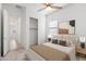 Cozy bedroom featuring a ceiling fan, closet, and a neutral color scheme for a relaxing atmosphere at 14075 W Desert Flower Dr, Goodyear, AZ 85395