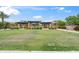Large community park featuring a stone outdoor kitchen and picnic area at 14075 W Desert Flower Dr, Goodyear, AZ 85395