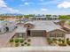 Charming single-Gathering home with a well-manicured lawn, desert landscaping, and paved driveway at 14075 W Desert Flower Dr, Goodyear, AZ 85395