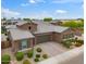 Stunning single-Gathering home featuring a three-car garage, meticulous landscaping and desert style plants at 14075 W Desert Flower Dr, Goodyear, AZ 85395