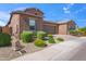 Charming single-Gathering home with desert landscaping and a well-manicured front lawn for maximum curb appeal at 14075 W Desert Flower Dr, Goodyear, AZ 85395