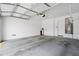 Clean and spacious garage with an automatic door and a water heater at 14075 W Desert Flower Dr, Goodyear, AZ 85395