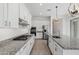 Kitchen with stainless steel appliances, granite countertops, and white cabinets at 14075 W Desert Flower Dr, Goodyear, AZ 85395