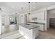 Open kitchen featuring stainless steel appliances, granite countertops and stylish pendant lighting at 14075 W Desert Flower Dr, Goodyear, AZ 85395