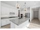 Stylish kitchen showcasing stainless steel appliances, granite countertops and modern pendant lighting fixtures at 14075 W Desert Flower Dr, Goodyear, AZ 85395