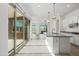 Bright kitchen featuring granite countertops, large windows, and backyard access at 14075 W Desert Flower Dr, Goodyear, AZ 85395