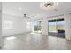 Spacious living room with bright natural light from sliding glass doors opening to the backyard at 14075 W Desert Flower Dr, Goodyear, AZ 85395
