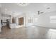Bright and airy living space with an open floor plan, connecting the kitchen and living room at 14075 W Desert Flower Dr, Goodyear, AZ 85395