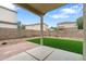 Private backyard features brick-paved patio and synthetic grass lawn at 1410 S Boulder St # A, Gilbert, AZ 85296