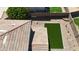 Aerial view of the backyard featuring low maintenance turf and rock landscaping at 1410 S Boulder St # A, Gilbert, AZ 85296