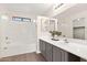 Bright bathroom features a combination shower and tub with a neutral countertop at 1410 S Boulder St # A, Gilbert, AZ 85296