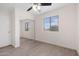 Bedroom with wood-look flooring, a window with blinds, and a closet with sliding doors at 1410 S Boulder St # A, Gilbert, AZ 85296