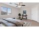 Bedroom features a ceiling fan, neutral walls and a large window for natural light at 1410 S Boulder St # A, Gilbert, AZ 85296