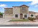 Charming two-story home featuring desert landscaping, neutral stucco, and a tile roof at 1410 S Boulder St # A, Gilbert, AZ 85296
