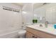 Bathroom featuring tub, white tile shower, toilet, and vanity with decorative plants at 14561 W Winding Trl, Surprise, AZ 85374