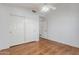 Bedroom with wood floors, closet and access to the other rooms at 14561 W Winding Trl, Surprise, AZ 85374